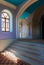 The interior of the Assumption-Bogoroditsky Monastery. Arched windows, rays of light and bright wall colors. Sviyazhsk. Kazan. Royalty Free Stock Photo