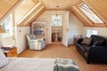 Interior of an attic bedroom with bathroom in a home Royalty Free Stock Photo