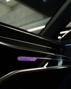 Interior of Audi RS6 Quattro illuminated badge - Black dashboard with aluminum accents, purple light