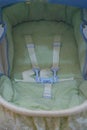 Interior of baby stroller with five point seat belt Royalty Free Stock Photo