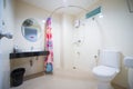 Interior of the bathroom with white toilet and basin