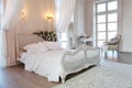 The interior of a beautiful bedroom Suite in bright white. Royalty Free Stock Photo