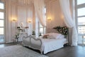 The interior of a beautiful bedroom Suite in bright white. Royalty Free Stock Photo