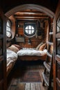 interior of bedroom cabin on medieval pirate ship. Inside ancient pirate sail boat