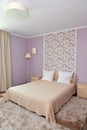 Interior of a bedroom of a double hotel room in light tones Royalty Free Stock Photo