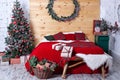 Interior bedroom with eco decor. Wood and nature concept in room interior rustic style. Scandinavian interior with christmas tree.