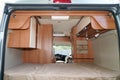 Interior bedroom modern vanlife campervan coach with luxury equipment Royalty Free Stock Photo