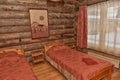 Interior of a bedroom with several beds, walls made of wood Royalty Free Stock Photo