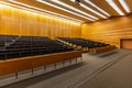 Interior of big conference hall full of gray folding chairs