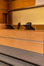 Interior of big conference hall full of gray folding chairs