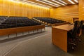 Interior of big conference hall full of gray folding chairs