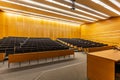 Interior of big conference hall full of gray folding chairs