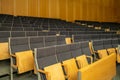 Interior of big conference hall full of gray folding chairs