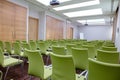 Interior of big conference hall with many green comfortable seats Royalty Free Stock Photo