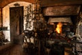 Interior of Blacksmith forge with tools hanging on wall and anvil and hammer ready to be used. Furnace formant Royalty Free Stock Photo