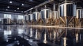 Interior of Brewery or alcohol production factory. Large steel fermentation tanks in spacious hall