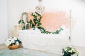 Interior of bright white bedroom with decorative flowers on a wall Royalty Free Stock Photo