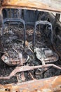 Interior of burnt out car on the side of a road Royalty Free Stock Photo