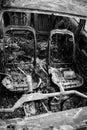 Interior of burnt out car on the side of a road Royalty Free Stock Photo