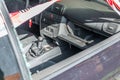 Interior of a burnt out car after a violent accident with police barrier tape in red and white with the German word for police bar Royalty Free Stock Photo