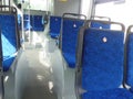 Interior of the bus both on the passenger side with seats and details of the driver`s seat Royalty Free Stock Photo