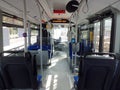 Interior of the bus both on the passenger side with seats and details of the driver`s seat Royalty Free Stock Photo