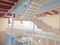 Interior of business center office building made with white ladders. Architectural and construction details. Modern and industrial Royalty Free Stock Photo