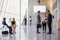 Interior Of Busy Office Foyer Area With Businesspeople