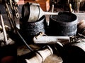 Interior, cabin and vintage tools, equipment and relics, barrels and bellows for storage of gear. Retro room, rustic