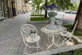 Interior of a cafe on the street. Nice decoration of the table and chairs Royalty Free Stock Photo
