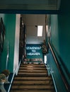 Interior of a cafe, the top of the stairs with a sign in led lights "Stairway to heaven"