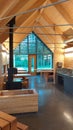 Canadian cabanon View of kitchen in wooden cabin decorated with industrial and warm design. Wood burning fireplace Royalty Free Stock Photo