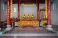 Interior of Canton Shrine with Golden Idols on an Ornate Altar