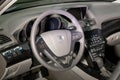 The interior of the car Acura MDX with a view of the steering wheel, dashboard, seats and multimedia system with light gray