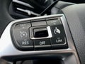 Interior of the car with cruise control buttons, voice communication on the steering wheel of the truck Royalty Free Stock Photo