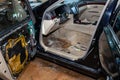 The interior of the car inside is partly disassembled, the steering wheel and door panels are removed for the repair in the