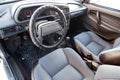 The interior of the car lada 2114 samara with a view of the steering wheel, dashboard, seats and multimedia system with light gray