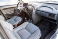 The interior of the car lada 2114 samara with a view of the steering wheel, dashboard, seats and multimedia system with light gray