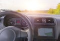 Terior of the car, the track at speed. mobile phone with GPS app in the car with a tablet computer screen.