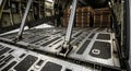 Interior of a cargo plane with pallets ready for shipping and global transportation Royalty Free Stock Photo