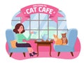Interior of cat cafe with large window, woman and two Kitties in comfortable armchairs. Girl and cat Tea party. Spending time with