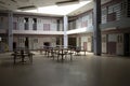 Abandoned jail common room in cell block Royalty Free Stock Photo