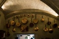 The interior of the Chenonceau castle. The cooking supplies hanging on the wall of the kitchen .