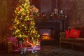 Interior christmas. magic glowing tree, fireplace, gifts in dark at night Royalty Free Stock Photo