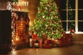 Interior christmas. magic glowing tree, fireplace, gifts in  dark Royalty Free Stock Photo
