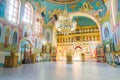 Interior of the church. Beautiful ancient images of saints in temple, fresco.