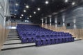 Interior cinema hall with plenty of seating and a projector Royalty Free Stock Photo