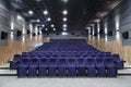 Interior cinema hall with plenty of seating and a projector Royalty Free Stock Photo