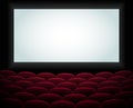 Interior of a cinema movie theatre, lecture hall with copyspace on the screen and rows of blue cinema or theater seats Royalty Free Stock Photo