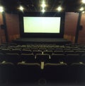 interior cinema at night with screen and seats without people Royalty Free Stock Photo